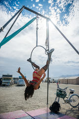aerialist artist on lyra at Burning Man 2019