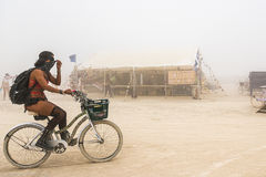 Burner biking on Burning Man bike on Black Rock City playa 